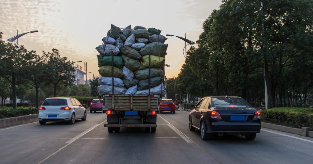 objects falling from overloaded truck