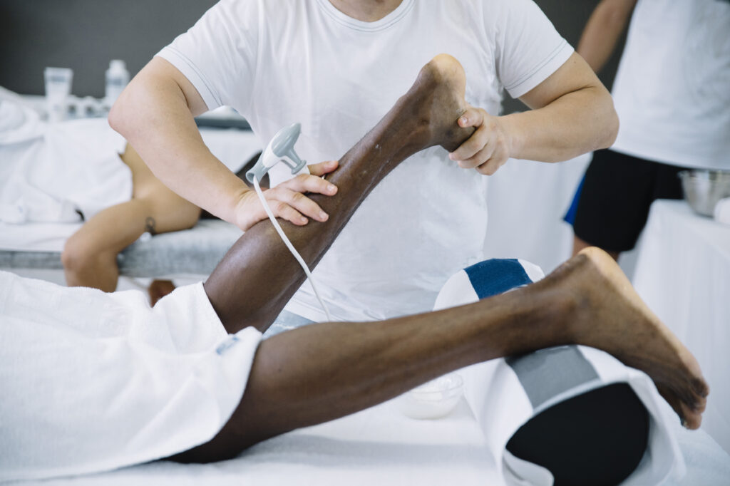 Motorcyclist receiving treatment during accident recovery